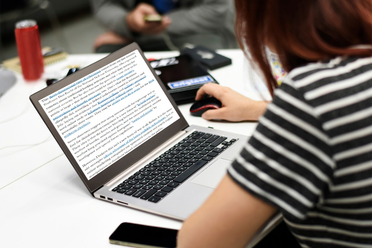 student in front of a laptop